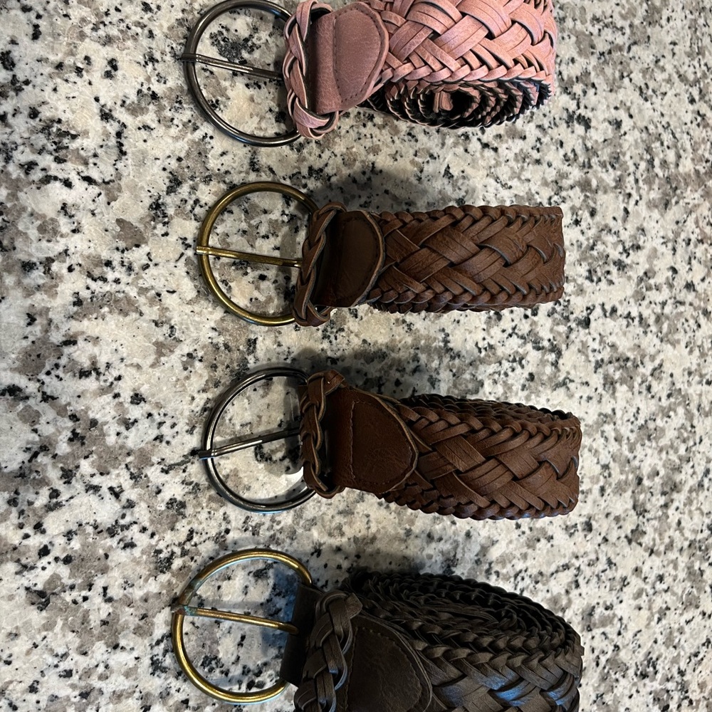 Brand new leather belts, size 14.  2 brown, 1 pink and 1 dark brown.